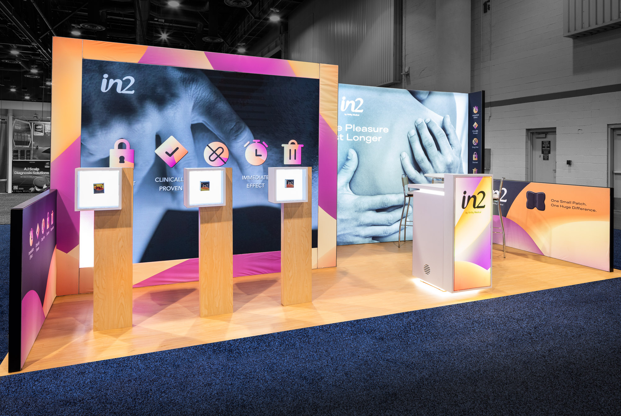 Exhibit booth with vibrant display, featuring branded panels with product icons on wooden stands.