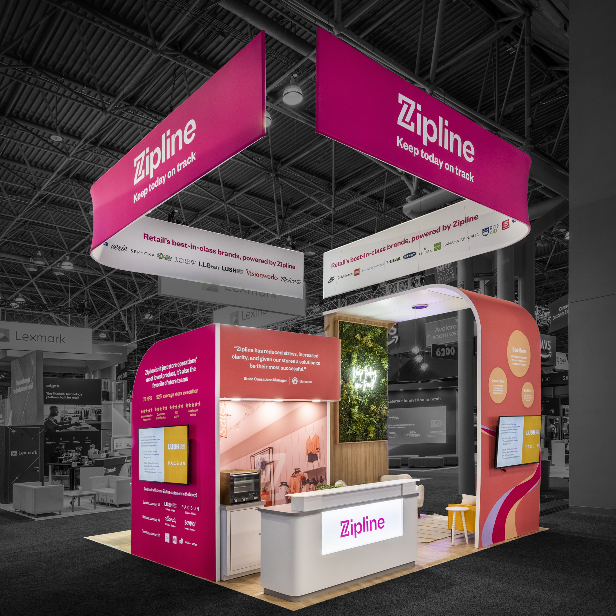 Exhibition booth with bright pink banners displaying "Zipline" and the slogan "Keep today on track."